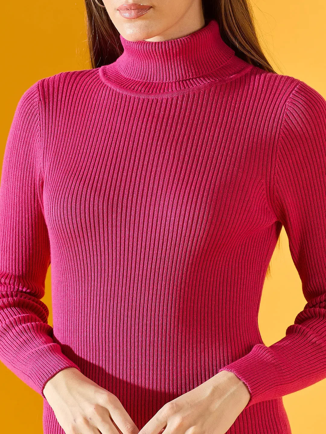 Model in 98degreenorth Women’s Ribbed Knitted Bodycon Dress – Fuchsia turtleneck, styled against a yellow background.