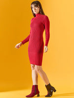 Woman wears 98degreenorth’s red ribbed turtleneck sweater dress against a yellow background.
