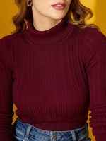 Woman in 98degreenorth Rosewood Ribbed Turtleneck Slim Fit Sweater, styled with blue jeans, against a yellow background.