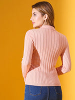 Woman in a 98degreenorth Salmon Ribbed Collar Neck Sweater and blue jeans stands against a yellow background, facing away.