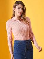 Woman wears 98degreenorth’s salmon ribbed collar neck sweater and denim skirt against a bright yellow background.