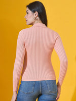 Woman in a 98degreenorth salmon ribbed collar neck sweater and blue jeans, facing away, yellow background.