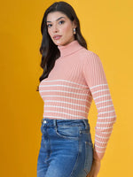 Woman in a 98degreenorth salmon ribbed turtleneck sweater and blue jeans, against a yellow background.