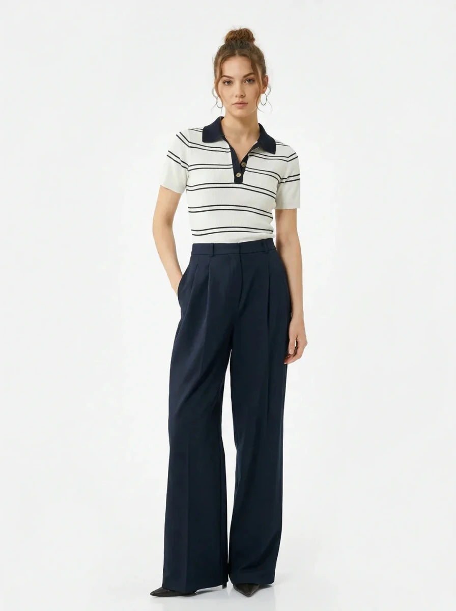 Woman wears 98degreenorth's Women's Striped Knit Polo Top—White & Navy—standing against a plain white background.