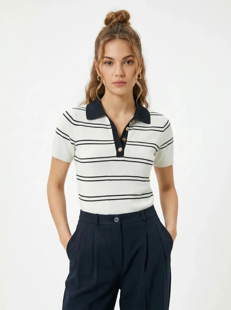 Model wears 98degreenorth Women's Striped Knit Polo Top - White & Navy with dark pants, hands in pockets.