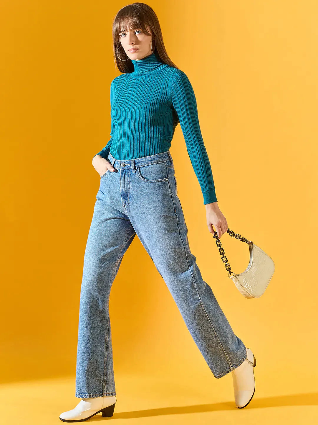 Woman wears 98degreenorth Teal Blue Ribbed Turtleneck Sweater—stylish, slim-fit winter wear for casual looks in India.