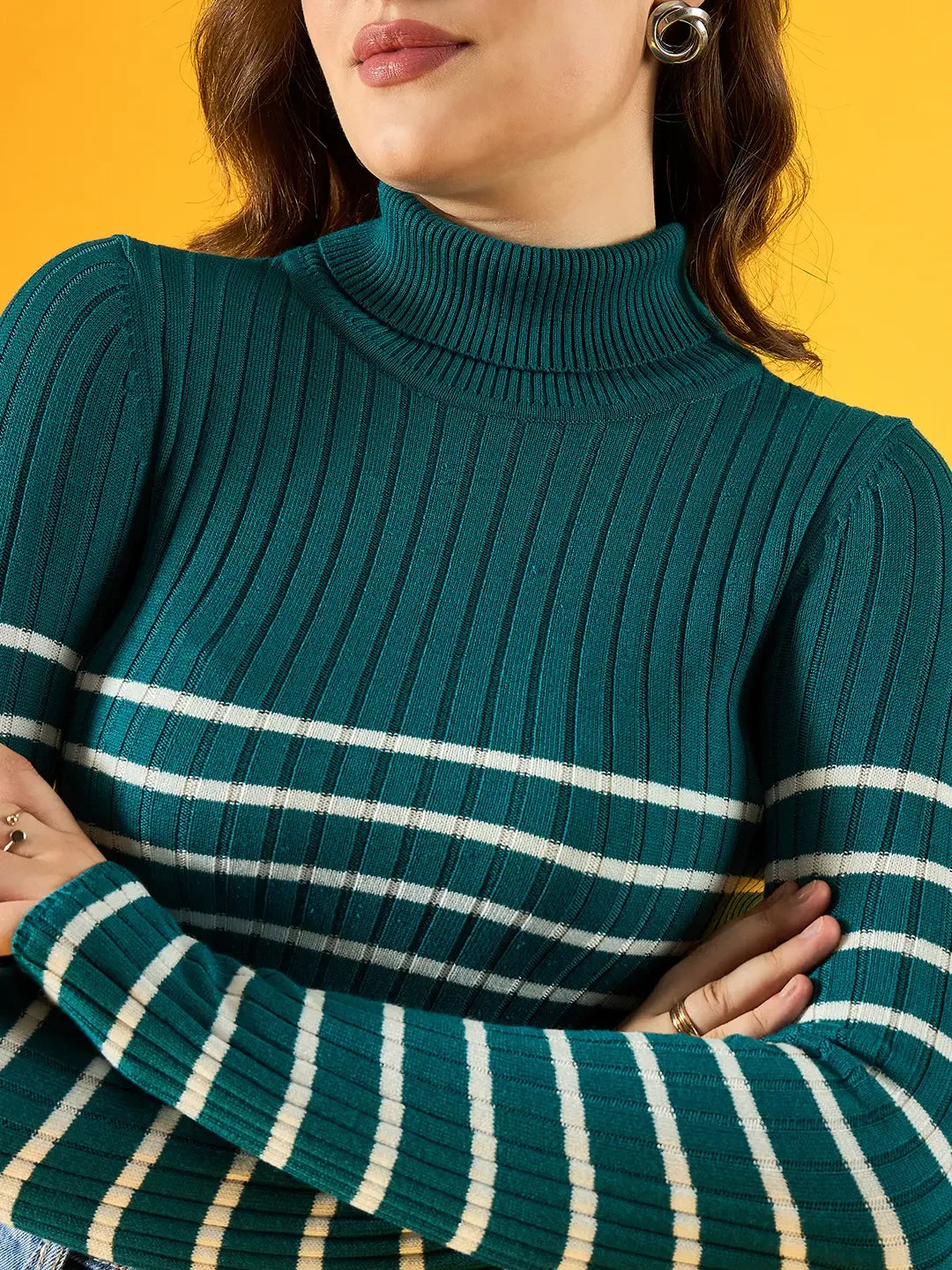 Woman models 98degreenorth's teal ribbed knit turtleneck sweater from the Trendy Winter Collection India.