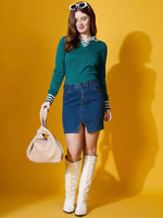 Woman wears 98degreenorth teal striped collar knit sweater—stylish polo-inspired pullover—against a yellow background.