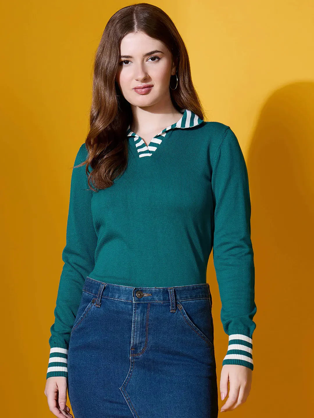 98degreenorth Women’s Teal Striped Collar Knit Sweater styled with a denim skirt, set against a yellow background.