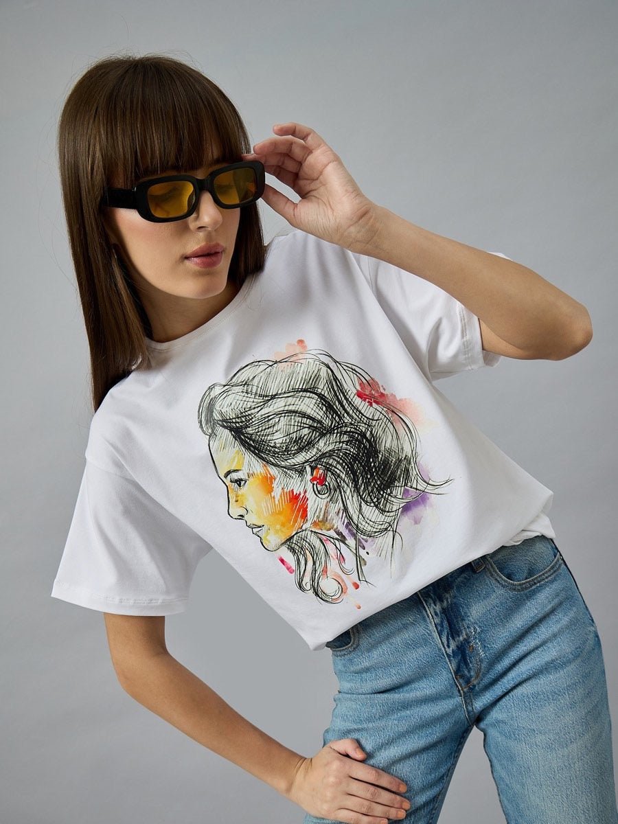 Woman in 98degreenorth Women’s Typography Cotton T-shirt, streetwear style, posing confidently with sunglasses.