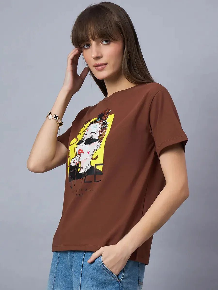 Woman wears 98degreenorth Women’s Typography Graphic Cotton T-shirt – Stylish Streetwear with blue jeans, poses casually.