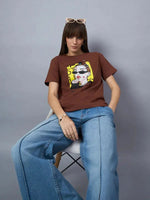 Woman in 98degreenorth Womens Typography Graphic Cotton T-shirt – Stylish Streetwear and wide-leg jeans, accessorized with sunglasses.