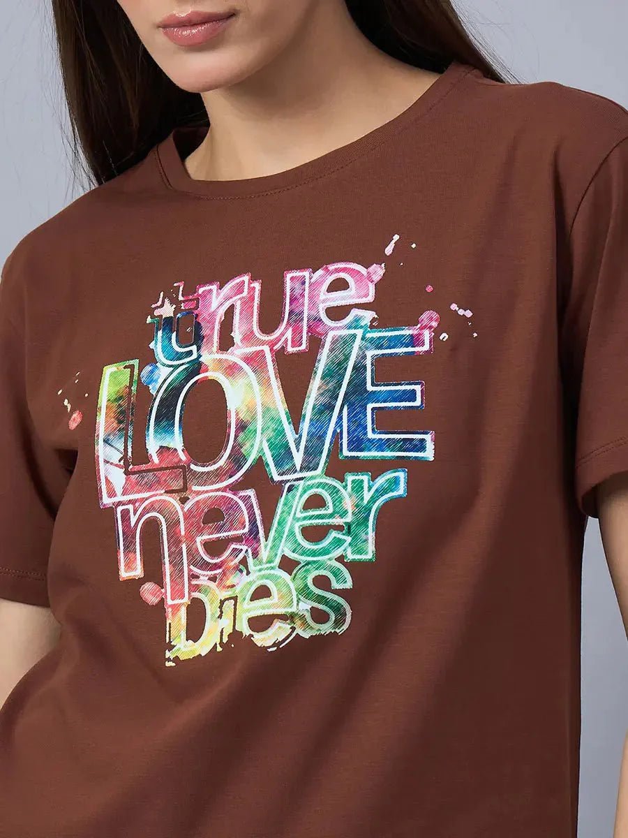 Woman wears 98degreenorth Women’s Typography Graphic Print Cotton Tee with “true LOVE never dies” text.