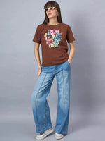 Woman wears 98degreenorth Women’s Typography Graphic Print Cotton Tee—Streetwear Essential—styled with wide-leg jeans.