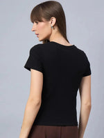 Woman in a 98degreenorth street-style women’s typography print cotton t-shirt, facing backward.