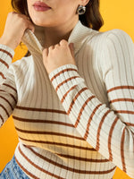 Woman wearing 98degreenorth’s white ribbed striped turtleneck sweater, styled chicly against a yellow background.