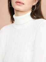 Shoulders-up view of woman in 98degreenorth White Ribbed Turtleneck Slim Fit Sweater, set against a beige background.
