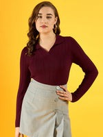 Woman in a 98degreenorth Women’s Wine Ribbed Collar Sweater and gray skirt poses against a yellow background.